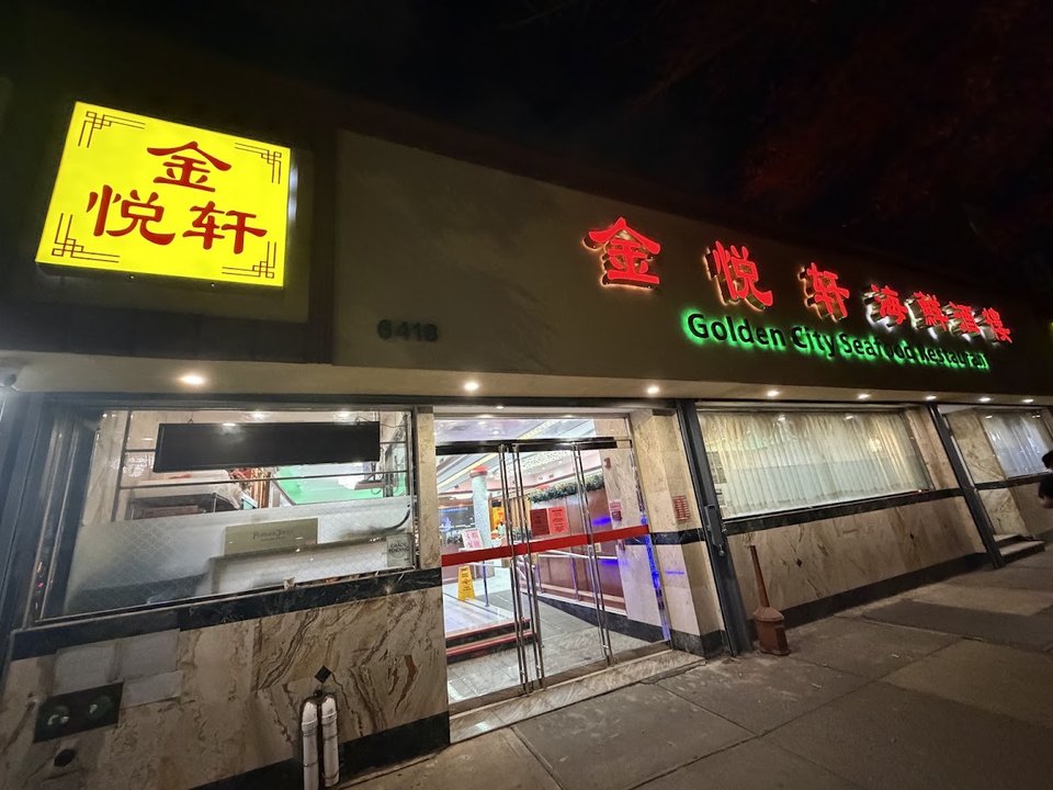 Steaming Cantonese dishes on a busy table.